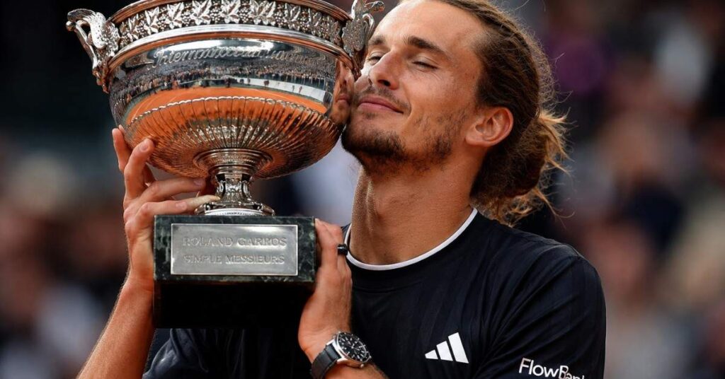 Alexander Zverev celebrates with the French Open trophy after victory.
