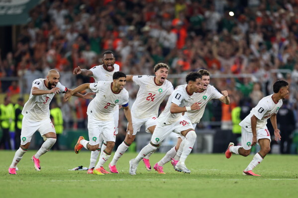 Morocco players after winning the Penalty Morocco players after winning the Penalty