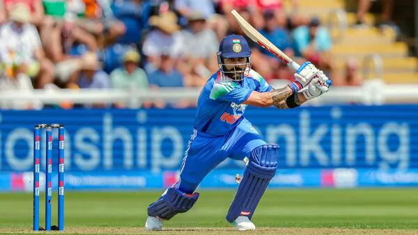 Virat Kohli playing a shot in the second ODI against England Virat Kohli playing a shot after breaking Tendulkar's 50-plus record against England