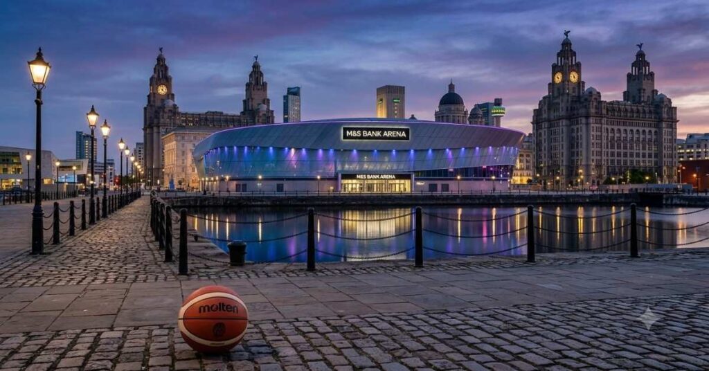 Molten basketball on the Liverpool dockside with the illuminated M&S Bank Arena in the background.