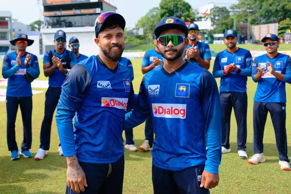 Sonal Dinusha receiving his team cap from Kusal Mendis on his international debut Sonal Dinusha receiving his team cap from Kusal Mendis on his international debut